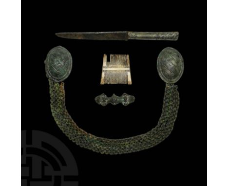 9th-10th century AD. A dress assemblage comprising: a matched pair of bronze tortoise brooches, each a shallow dome bearing l