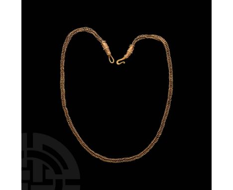 c.10th-12th century AD. A gold chain composed of openwork links of X-shaped cross-section, tapering round-section sleeve term