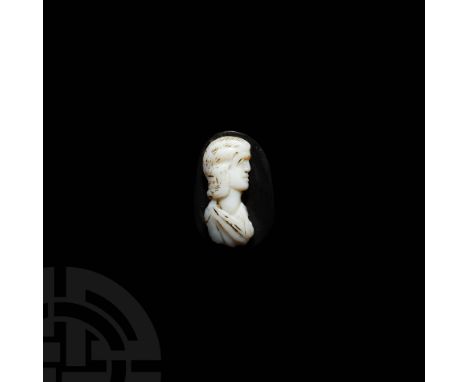 Late 2nd-early 3rd century AD. A layered agate cameo portraying a noble lady or an empress in profile, hair falling to just a