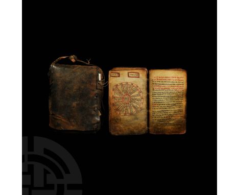 Early 19th century AD. A vellum manuscript of 123 leaves bound within wooden boards, the front upper with incised decoration 