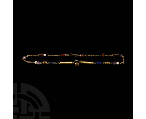 c.1st century AD and later. A gold necklace composed of linked chain, sheet-gold tubular beads with caps, gold beads with car