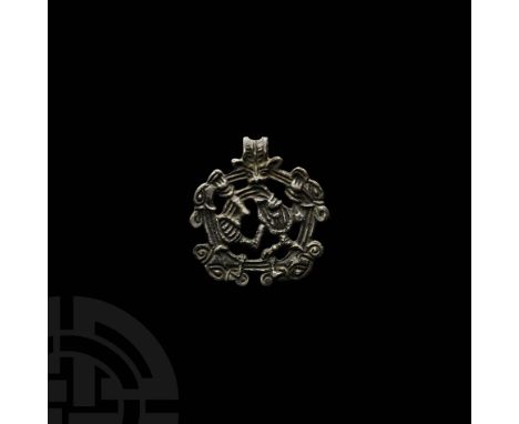 10th-11th century AD. A Smolensk-type concave-section pendant with integral suspension loop; the openwork plaque with three-b