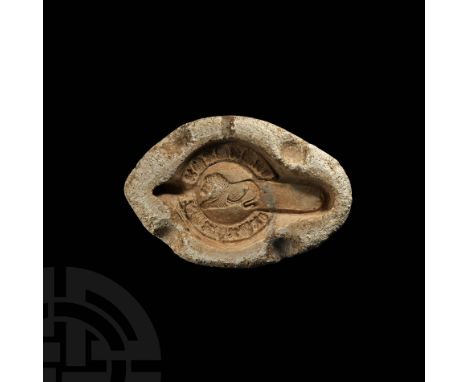 4th-5th century AD. A gypsum lamp mould half showing a recumbent lion, surrounded by alternating palm flowers and quatrefoils