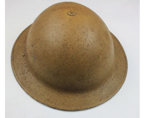 British WW2 steel helmet with Desert sand campaign finish, service wear, displays well