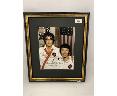 A PERSONAL PHOTO BELONGING TO ELVIS PRESLEY SIGNED BY KANG R LEE, MARTIAL ARTS TRAINER 