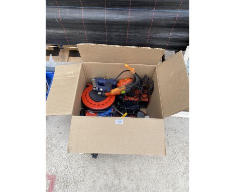 AN ASSORTMENT OF POWER TOOLS TO INCLUDE A STAPLE GUN, A BATTERY CHARGER AND AN EXTENSION LEAD ETC 