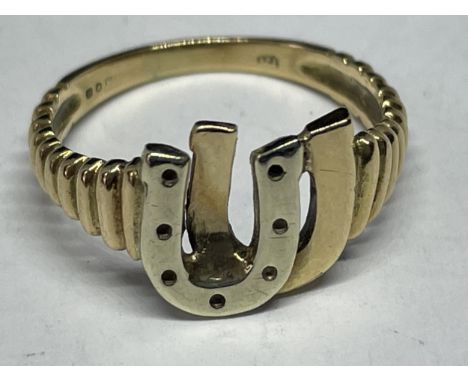 A 9 CARAT GOLD RING WITH HORSESHOE DESIGN GROSS WEIGHT 2.55 GRAMS SIZE M/N 