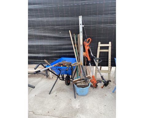AN ASSORTMENT OF GARDEN TOOLS TO INCLUDE BRUSHES, STRIMMERS AND A FOLDING BARROW ETC 