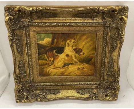 A VICTORIAN GILT FRAMED OIL ON METAL OF TWO HUNTING DOGS, FRAMED BY BIGGS &amp; SONS 
