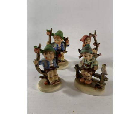 A GROUP OF FOUR VINTAGE GOEBEL HUMMEL FIGURES 