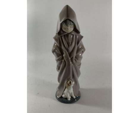 A NAO FIGURE OF A BOY IN ROBE WITH A DOG 