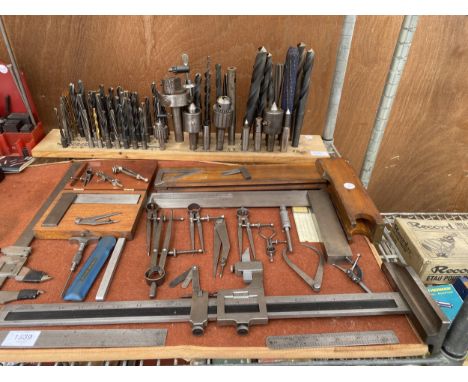 AN ASSORTMENT OF ENGINEERS TOOLS TO INCLUDE CALIPERS AND SET SQUARES ETC
