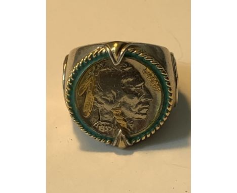 A LARGE RING WITH A FIVE CENT COIN ENGRAVED 'INDIAN HEAD NICKEL HONOURING THE AMERICAN WEST' 