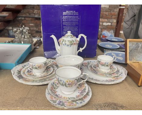 A VINTAGE PARAGON FLORAL COFFEE SET TO INCLUDE A COFFEE POT, CAKE PLATES, THREE CUPS, SAUCERS AND SIDE PLATES, AND A SUGAR BO