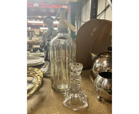 A VINTAGE SCHWEPPES SODA WATER BOTTLE PLUS A GLASS CANDLESTICK 