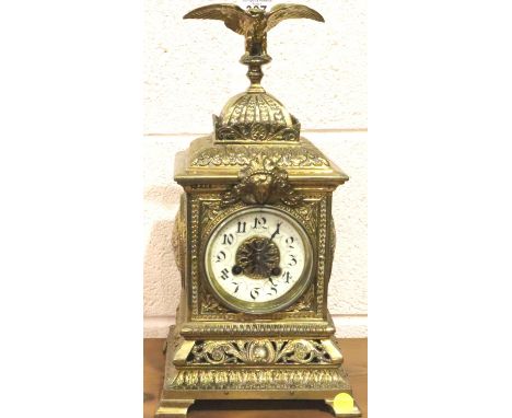 J Martin, a French lacquered brass table clock with enamelled chapter ring chiming on a gong and eagle pediment, H: 38 cm. Wo