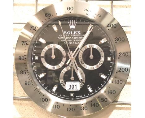 Dealers point of sale wall clock with sweeping second hand and cosmograph dial. P&amp;P Group 3 (£25+VAT for the first lot an