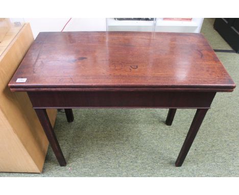 Edwardian fold over Mahogany Card table on straight supports 