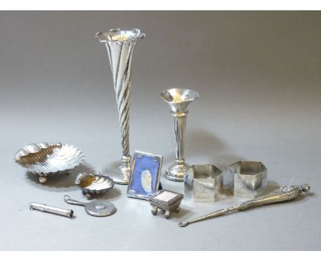 Small silver items, comprising propelling pencil, hand mirror, pair of napkin rings, two shell shaped dishes, two solifleur v