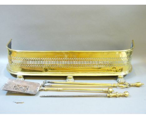 A brass fender, and fire tools