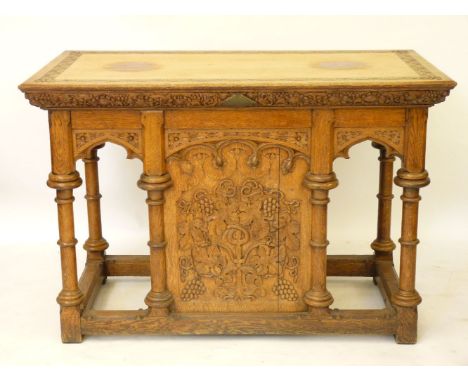 A Victorian carved light oak altar, with carved vines and turned columns, with cupboard in back, 136cm wide, 91cm high