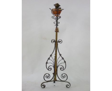An Arts & Crafts wrought iron, copper and brass adjustable standard lamp, circa 1900, 137cm high, and an early Victorian pier