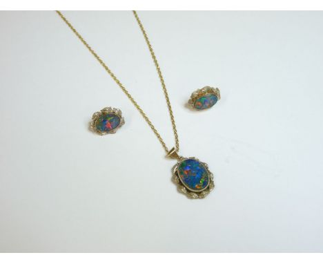 A gold black opal doublet pendant and earring suite, on a gold plated chain