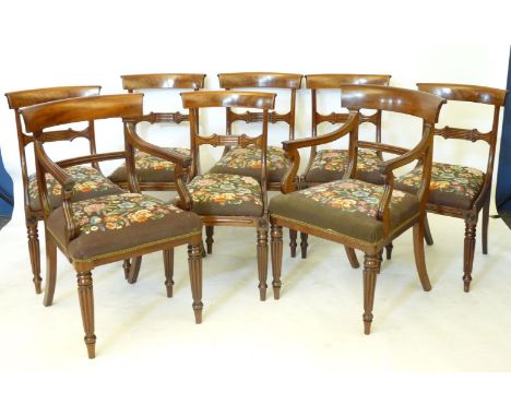 A set of eight Victorian mahogany bar back dining chairs, with drop in tapestry seats and turned gadrooned front legs