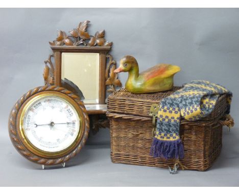 A wall mounted barometer, with an oak rope twist surround, 28cm diameter, a Black Forest carved softwood wall mirror, 46cm hi