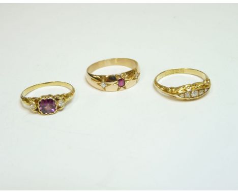 An 18ct gold five stone boat shaped ring, Birmingham 1910, a Victorian garnet and diamond three stone ring, and a three stone