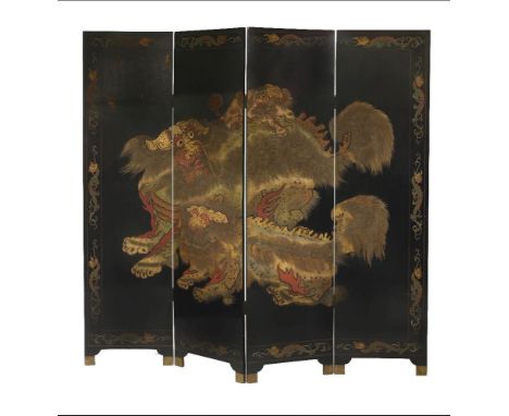 A four fold screen, circa 1900, low relief carved with Buddhist lions, the border with dragons, the reverse with birds and fl