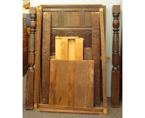 An oak four poster bed, with an inlaid panel headboard