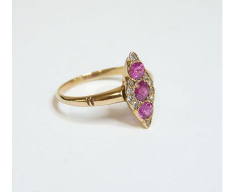 A ruby and diamond marquise shaped cluster ring, finger size M