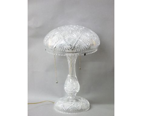 A cut glass mushroom lamp, circa 1920, cut glass stem and the dome glass shade resting on a chromed fitting, decorated throug