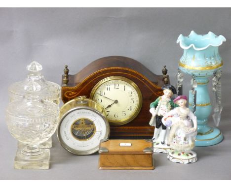 An Edwardian strung mahogany mantel clock, 15cm high, a brass wall mounted aneroid barometer, 10cm diameter, an oak stamp box