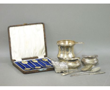 A silver christening tankard, a pair of salts, three silver items, butter knife, jam spoon, and a cased set of berry spoons