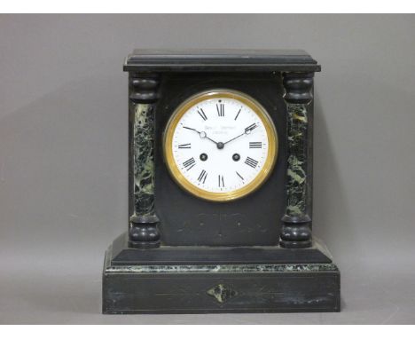 A black slate and marble mantel clock, the dial inscribed 'Bennett Brothers, Liverpool', 30cm high