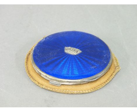 A silver and enamel compact