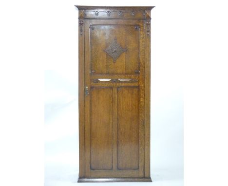 An early 20th century oak hall robe, with three panel front, 84cm wide