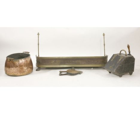 A copper log bin, a brass fender on paw feet, a coal bin, bellows, and fire tools