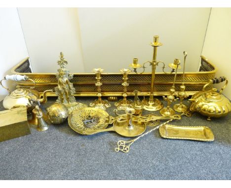A quantity of 19th century and later brassware, to include a pierced fender, candlesticks, adjustable candlestick, skimmer, k