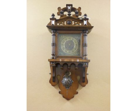 An Art Nouveau 'Vienna Regulator' wall clock, with stylised brass dial and pendulum, together with a three train striking man