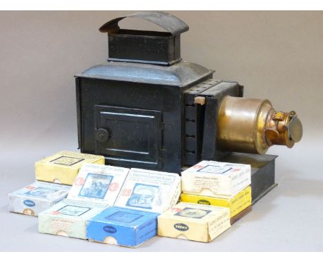 A magic lantern, painted tin and brass, twelve boxed sets of Primus Junior and Junior Lecturer's series, coloured lantern sli
