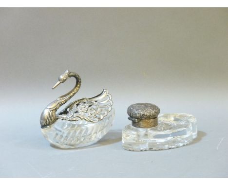 A silver mounted and cut glass swan with hinged wings, and a silver mounted and cut glass inkwell with pen rest