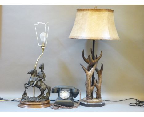 A faux antler table lamp, another lamp, the base modelled as a Hussar, and a telephone