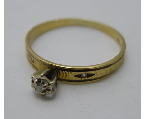 A 10 K gold and diamond ring