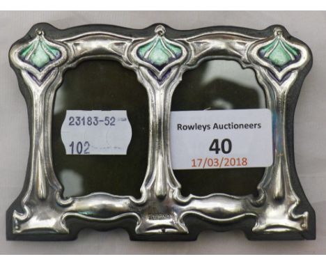 An Art Nouveau style sterling silver and enamel double photograph frame