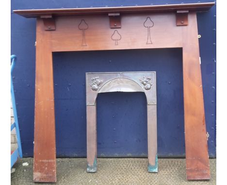 An Art Deco fire surround with a copper insert