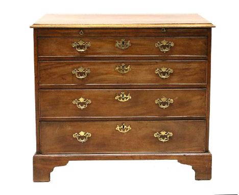 A George III Mahogany Straight Front Chest of Drawers, late 18th century, the moulded top above a pull-out brushing slide and