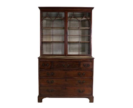 A George III Mahogany Display Cabinet, late 18th century, the dentil cornice above astragal glazed doors enclosing fabric-lin